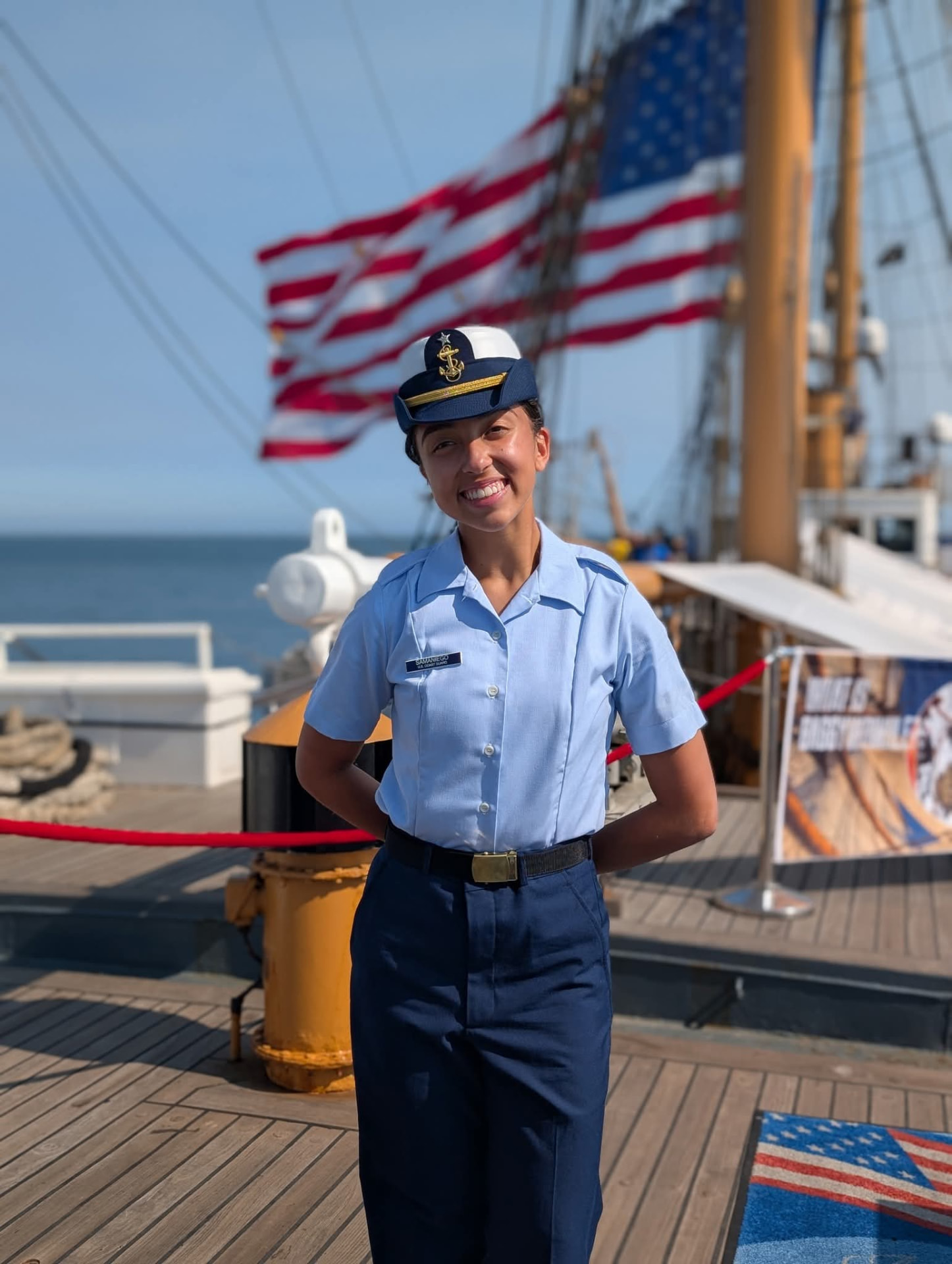 Bella Samaniego in Coast Guard Academy uniform aboard a cutter deck