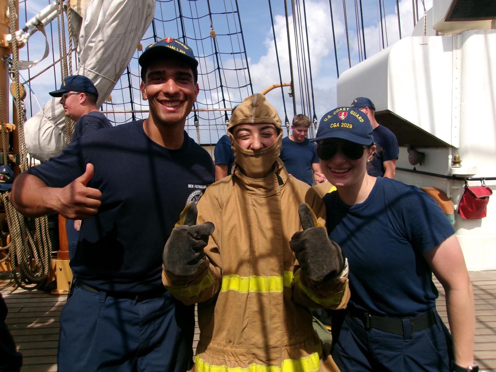 Bella Samaniego with shipmates during a firefighting drill on the deck of USCGC EAGLE
